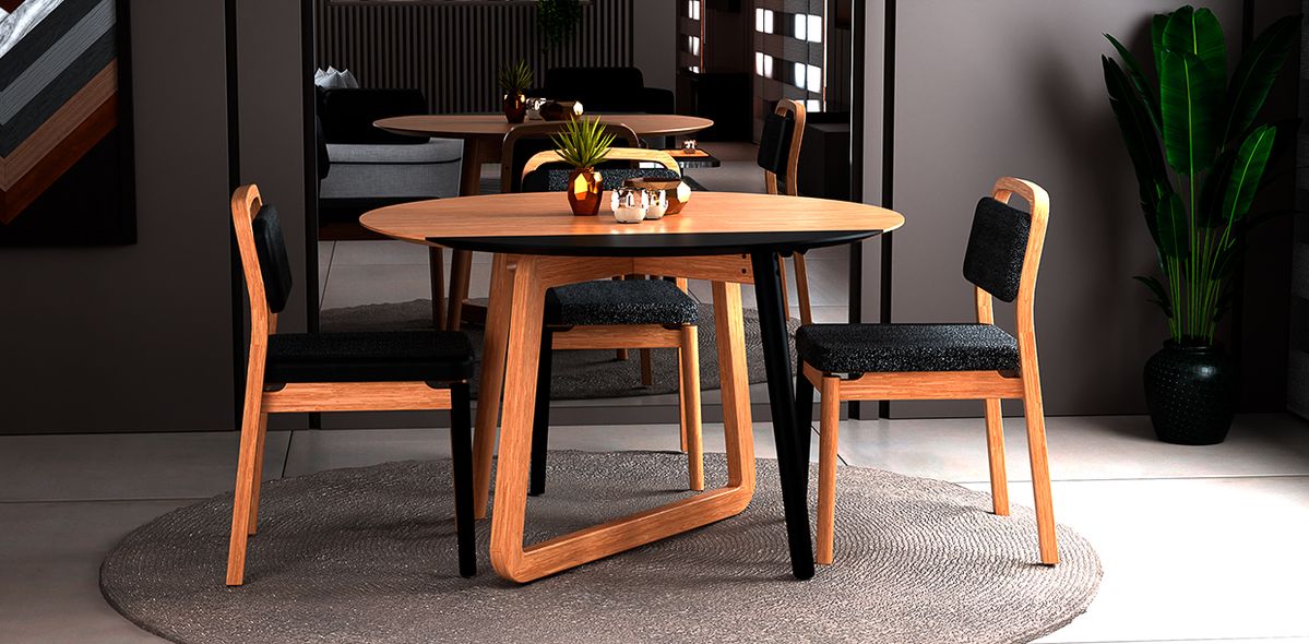 Mesa de jantar com aba preta, base mista e três cadeiras de madeira com assento estofado na cor preta.