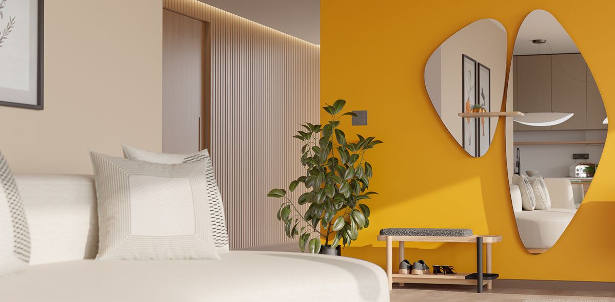 Imagem de um ambiente moderno com uma parede amarela decorada com plantas e espelhos e sofá na cor branca.