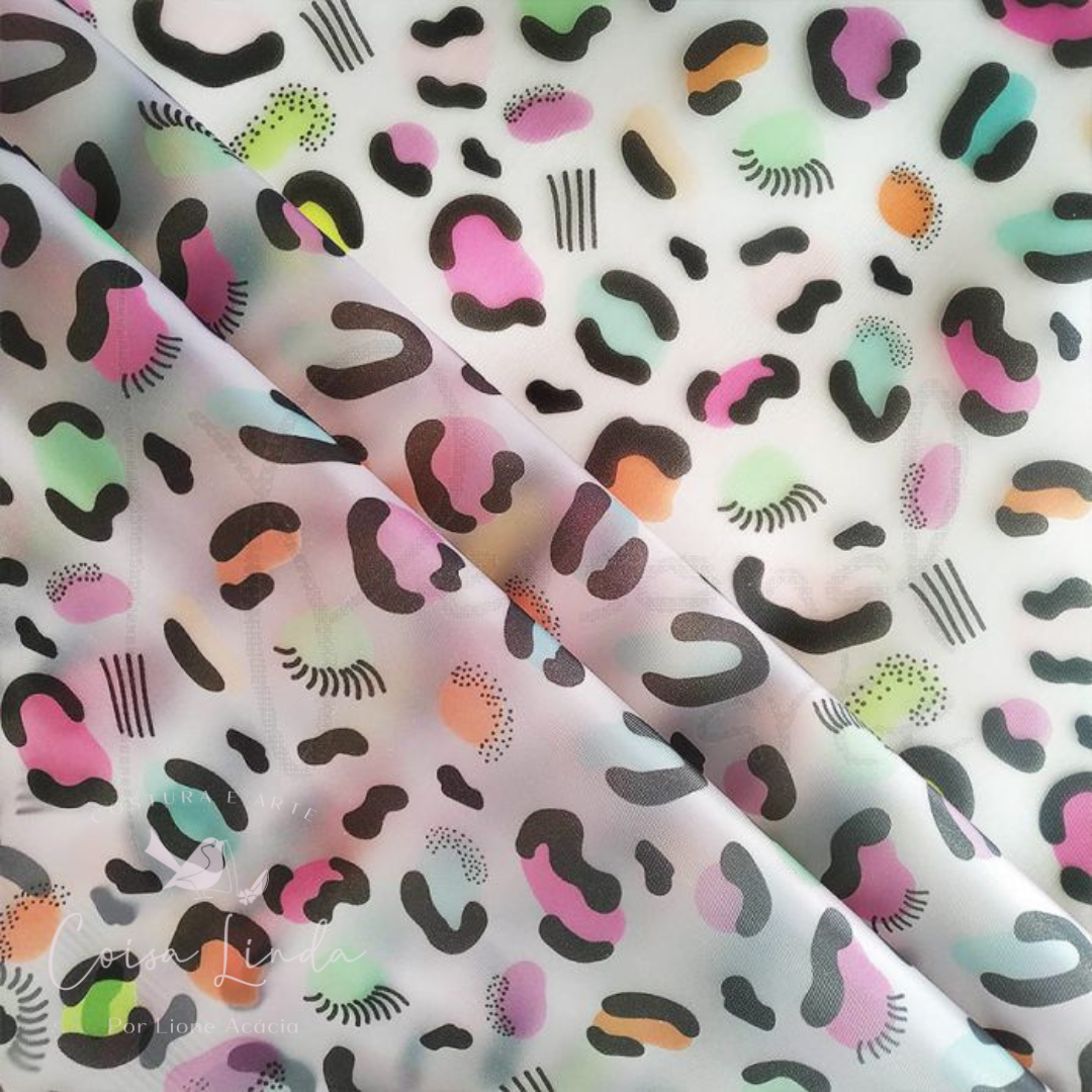 PLÁSTICO TRANSLÚCIDO ESTAMPADO ONÇA COLORIDA