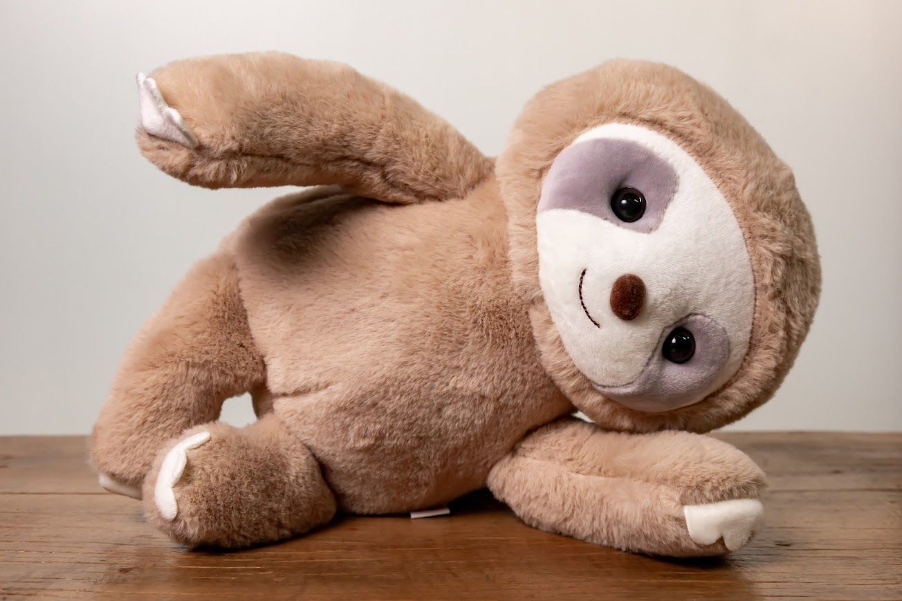 Pelúcia Preguicinha Bege 